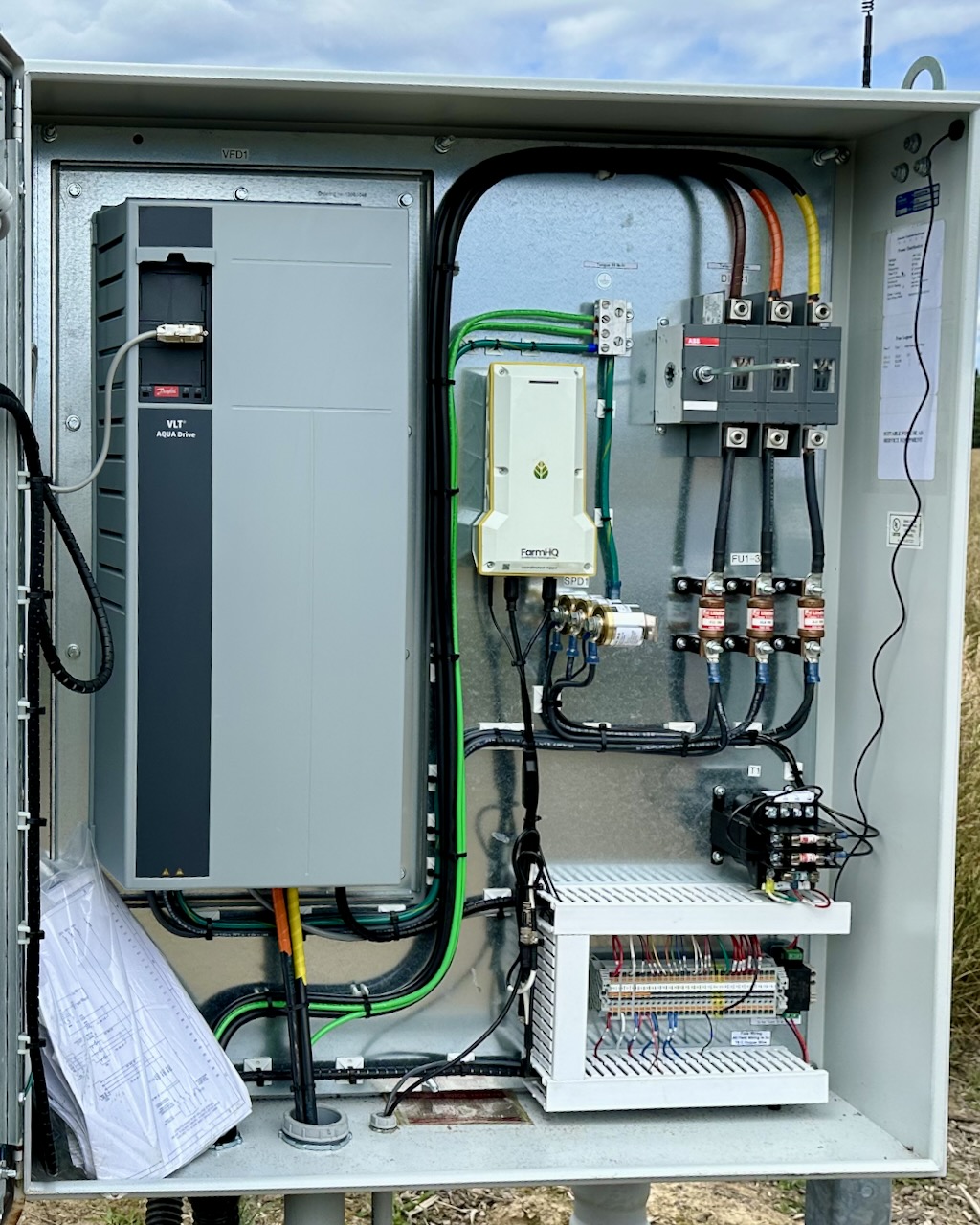 FarmHQ TC-3 device wired into an electric pump panel with a Variable Frequency Drive (VFD)