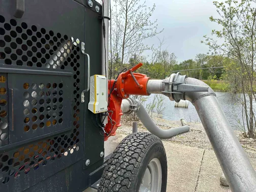 FarmHQ support team works on a hard hose irrigation reel